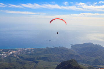 Paragliders flying from a top of Tahtali mountain near Kemer, Antalya Province in Turkey. Concept...