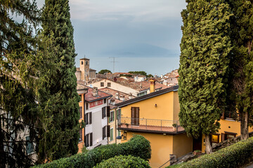View of Lake Garda and the roofs of the houses in Desenzano. A clear autumn evening. Desenzano, Verona, Italy
