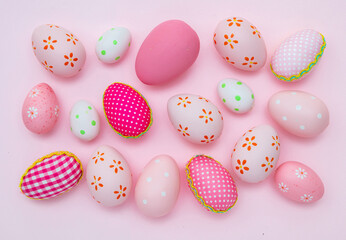 Happy Easter. Pink pastel color eggs variety on pink background