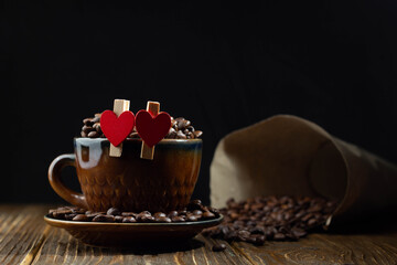 Coffee beans in the cup with two hearts