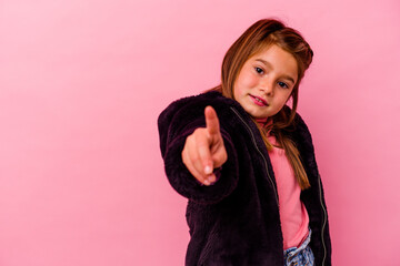 Little caucasian girl isolated on pink background