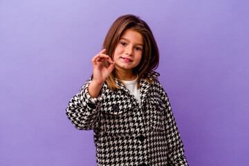 Little caucasian girl isolated on purple background Little caucasian girl isolated on purple...