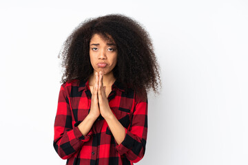 Young african american woman over isolated background keeps palm together. Person asks for something