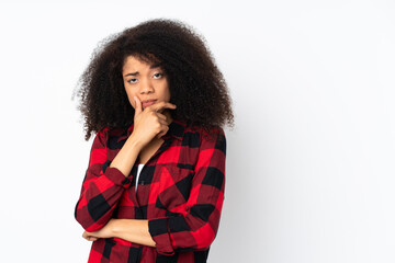 Young african american woman over isolated background having doubts