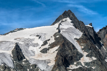 Fototapeta na wymiar National Park Hohe Tauern With Grossglockner The Highest Mountain Peak Of Austria And The Alps