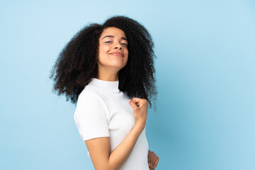 Young african american woman over isolated background proud and self-satisfied