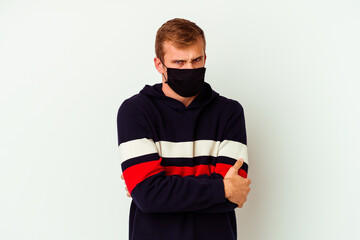 Young caucasian man wearing a mask for virus isolated on white background