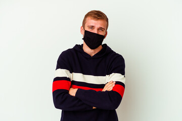 Young caucasian man wearing a mask for virus isolated on white background