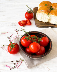  tomatoes in a plate and bread