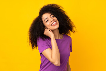 Young african american woman over isolated background laughing