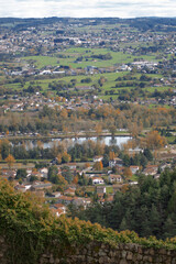 Panoramic view over small french village, surrounded by the nature. Autumn panorama. Reflection of trees in the water