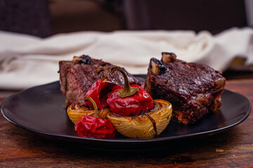 roast beef cut beef rib with pepper onion and arugula salad and lettuce