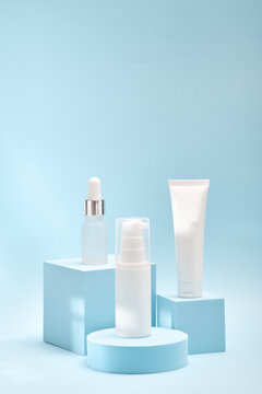 Three cosmetic product mockups on geometric podiums. Background for presentation of cosmetic