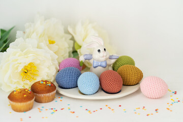 Happy easter. Knitted easter egg.  Concept. Stylization. Needlework. Environmentally friendly toys for children to develop fine motor skills. Hand made toys. 
