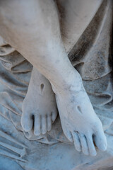 Fototapeta na wymiar Christ's feet with stigmata in cemetery pieta