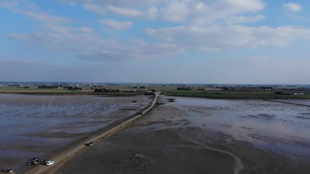 view of car crossing The passage du Gois, Noirmoutier island. France. Aerial view of Noimoutier submergible road (Gois). 