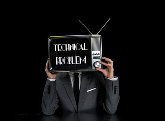 Man wearing suit with TV on head
