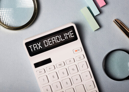 Tax Deadline Inscription On White Calculator On Ofice Desk