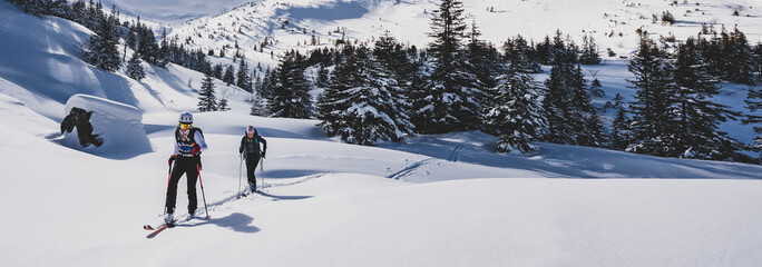 Mountaineer backcountry ski walking ski alpinist in the mountains. Ski touring in alpine landscape...