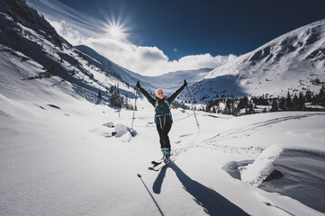 Mountaineer backcountry ski walking ski alpinist in the mountains. Ski touring in alpine landscape...