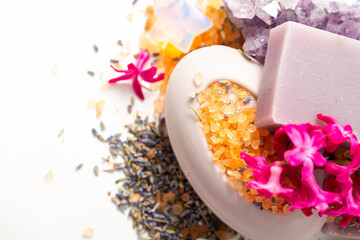 Medicinal bath salt, natural soap, dried organic lavender, hyacinth flowers and other skin care products. Top view