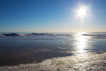 early spring sea landscape with ice and water