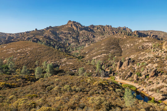 Rock formations in Pinnacles National Park in California, the destroyed remains of an extinct volcano on the San Andreas Fault. Beautiful landscapes, cozy hiking trails for tourists and travelers.