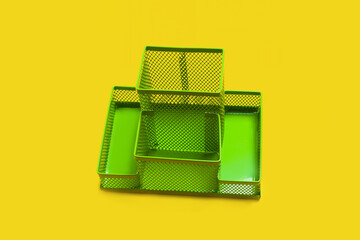 green empty pencil holder isolated on yellow background