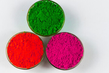 Top view of Colorful gulal Organic colour with white background for Indian Holi Festival. Happy Holi