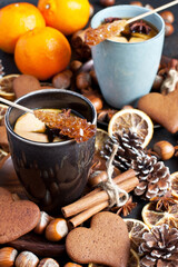 Cup of tea, apple, spices, nuts and  cookies