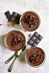 Homemade delicious chocolate mousse or panna cotta . Top view with copy space.