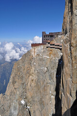 An old chalet located directly on a rock above the town of Chamonix in France