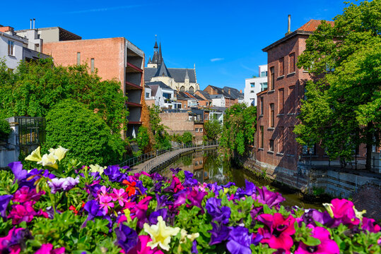 Old street and river Dyle in Mechelen, Belgium. Mechelen is a city and municipality in the province of Antwerp, Flanders, Belgium.