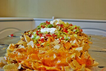 Nacho table kitchen table wrapped in aluminum foil and covered with nachos