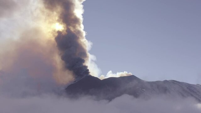 Aerial shooting with drone of the paroxysm of the Etna volcano by day 02 March 2021. Explosions, lava and column of smoke that covered the neighboring Etna villages with ash and lapilli.