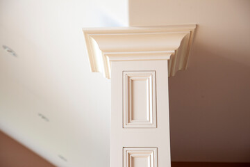 Closeup of a white column inside a home