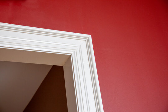 corner of a doorway and red wall