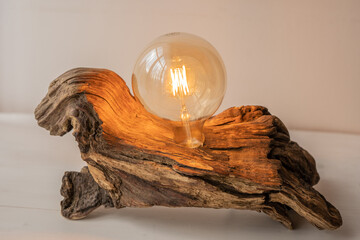 natural raw drift wood house light with exposed led light bulb decoration © Lumistudio