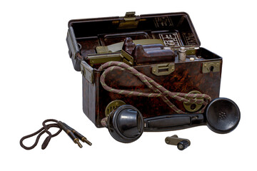 Old military field telephone in box, isolated