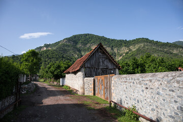 Fototapeta na wymiar Picture of beautiful village house with garden. Azerbaijan village in summer time