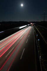 Fototapeta na wymiar traffic on highway in the moonshine 