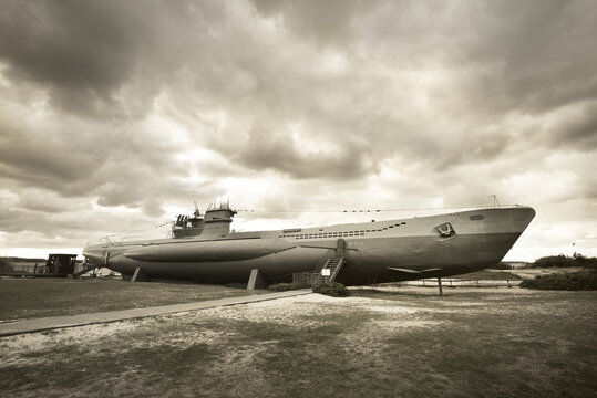 German submarine U-995. Dramatic sky, storm clouds. Museum ship, Laboe Naval Memorial. Germany. Panoramic view, sepia image effect. Landmarks, sightseeing, history, past, war, WW2, nautical vessel