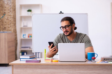 Young male designer working in the office