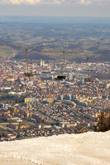 Maribor city from Pohorje, Slovenia. Chair Lifts with city in the background.