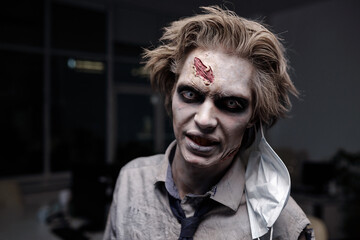 Spooky businessman with zombie greasepaint on face looking at you with gloomy expression