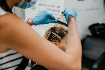 hairdresser coloring blonde balayage hair