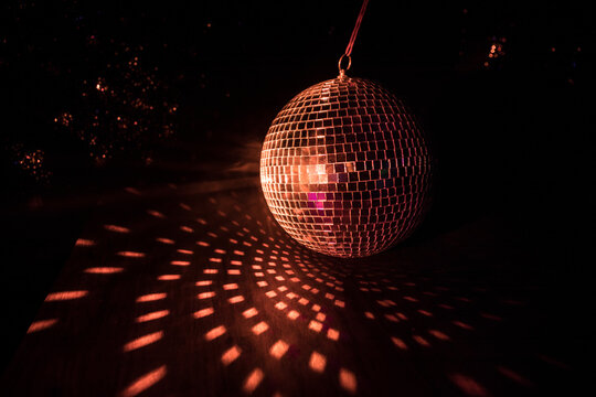 Colorful disco mirror ball lights night club background. Party lights disco ball. Selective focus