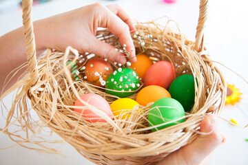 Easter pattern of Eggs with flowers and candies on the white background. Easter concept. Healthy feeding concept.