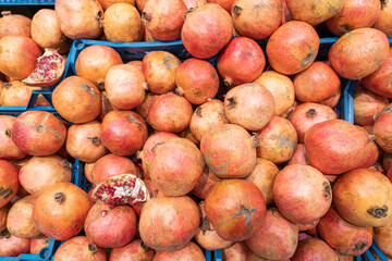 ripe pomegranate fruits close up as background