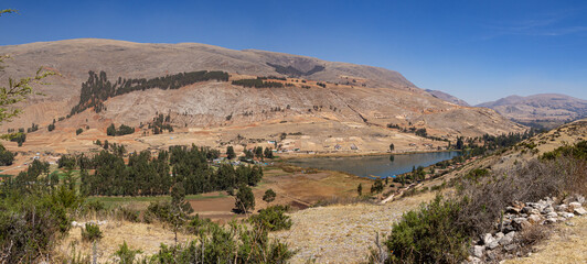 Landscape of beautiful lake, mountains and trees in natural park Huancayo, peru
